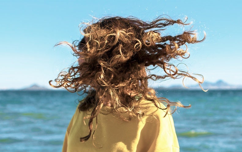 Why Hair Turns Curly and Frizzy in the Summer months, according to Chemistry